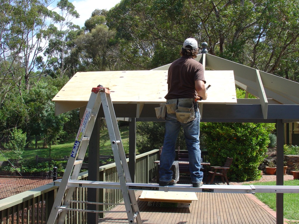 Nailing the first sheet of ply into place Nailing the first sheet of ply into place