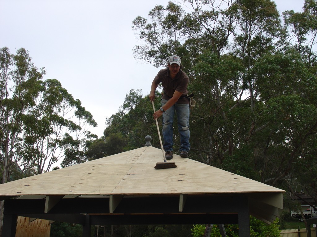 Sweeping the sawdust off the deck for saftey Sweeping the sawdust off the garden gazebo deck for saftey