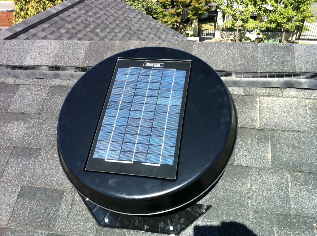 Solar powered vent installed close to ridge out of view